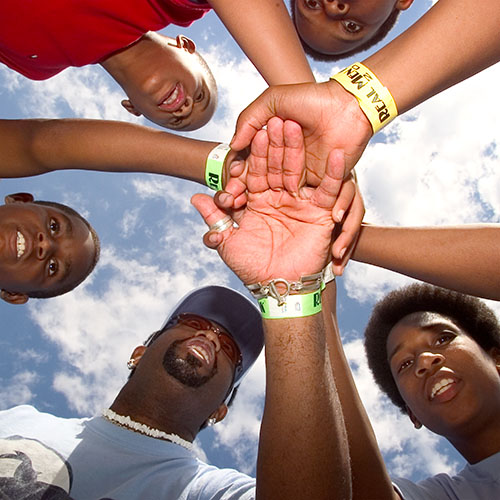 All hands in Up shot of People in a huddle